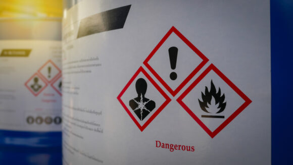 Chemical,barrels,tank,with,a,warning,label,in,chemical,factory
