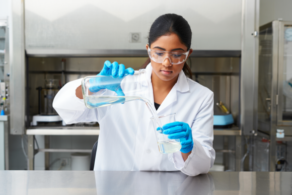 Surfactant Blending Services Chemist Pouring